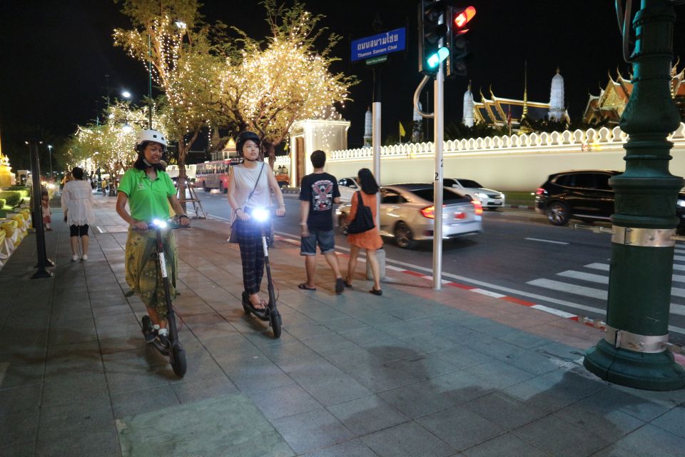 Bangkok: E-Scooter Night Tour with Local Street Food - Wat Pho and the Grand Palace at night: magnificent, even when closed