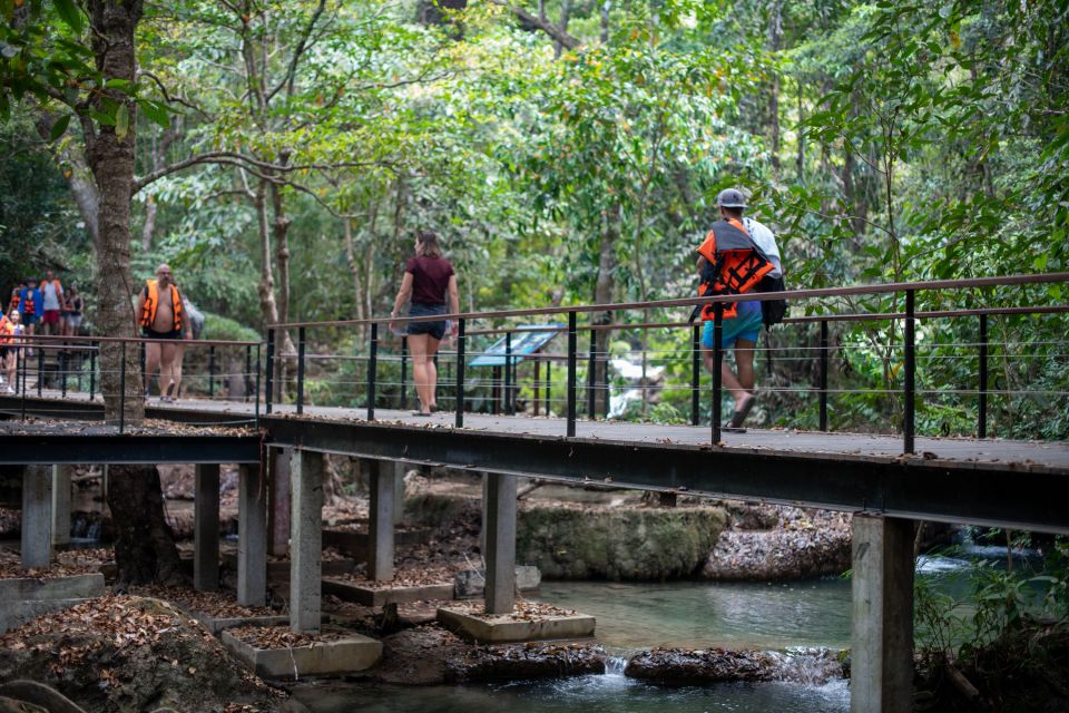 Bangkok: Elephant Sanctuary & Erawan Waterfall Tour - Erawan National Park Hike: Caves, Steps, and Choosing Your Tier