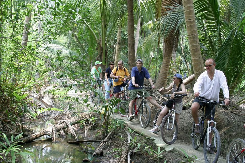 Colors Of Bangkok: 4-Hour Small Group Bike Tour - Bang Krachao riding: coconut shade, elevated paths, and narrow stretches