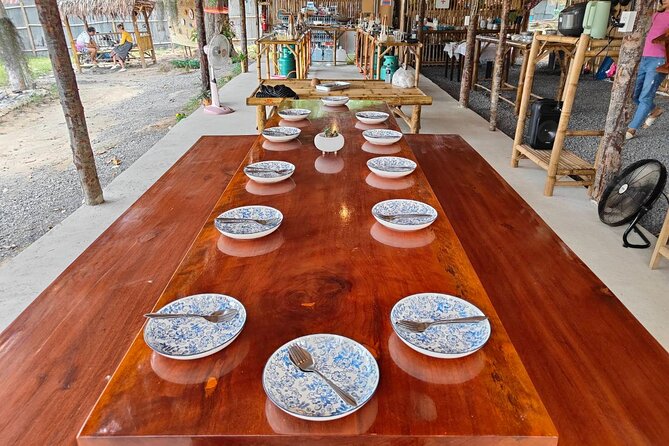 Cooking Class by Samui Native Instructor Geng and O Family - Bamboo Stations, Coconut Grating, and Chef Geng’s Teaching Style