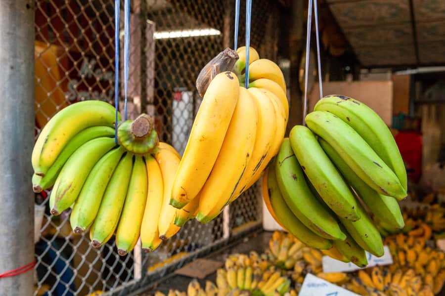 From Bangkok: Maeklong Railway and Floating Market Food Tour - Damnoen Saduak Floating Market: Boat Shopping Meets Tourist Reality