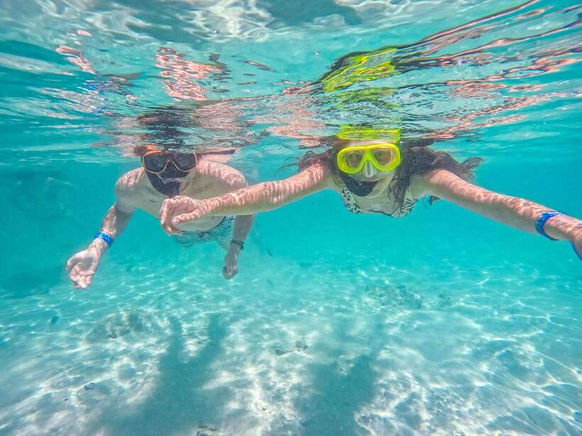 From Krabi: Maya Bay, Bamboo & Phi Phi Islands Day Tour - Phileh Lagoon snorkeling: clear water time against towering cliffs