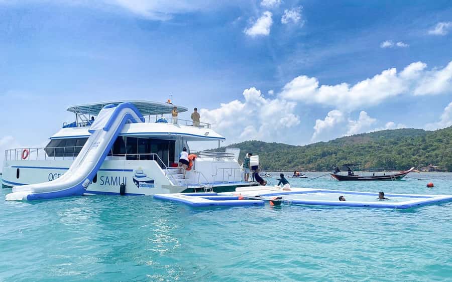 Koh Samui: Koh Tan and Koh Madsum Half-Day Tour by Catamaran - The inflatable slide and water sports rhythm