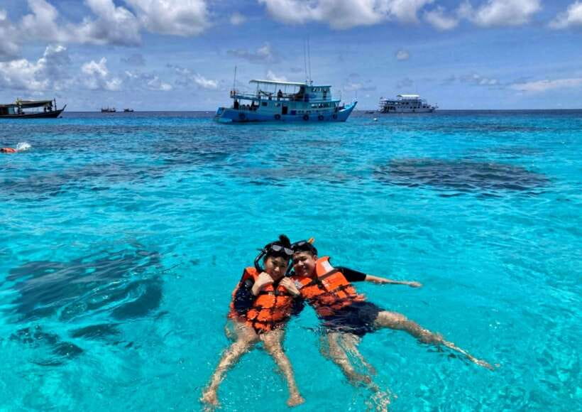 Phuket: Coral Island Catamaran Cruise with Sunset Dinner - Coral Island free time: beach, photos, and paid water activities